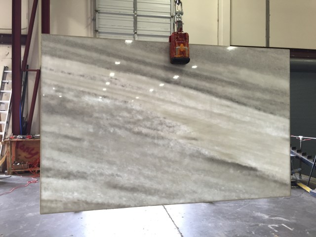 Quartzite is so beautiful - check out what sunlight looks like through Slab #2 when it travels through the slab. So gorgeous! Too bad we'll never see it like that in the house.