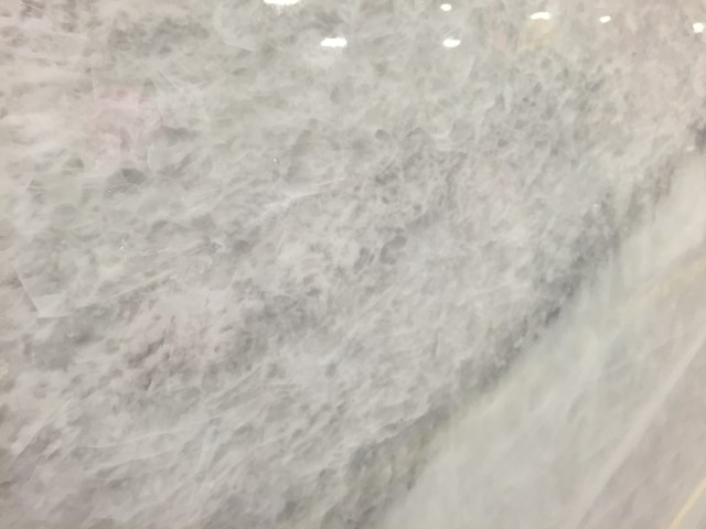 The slab is so beautiful up close - love the crystal-esque pieces in it.