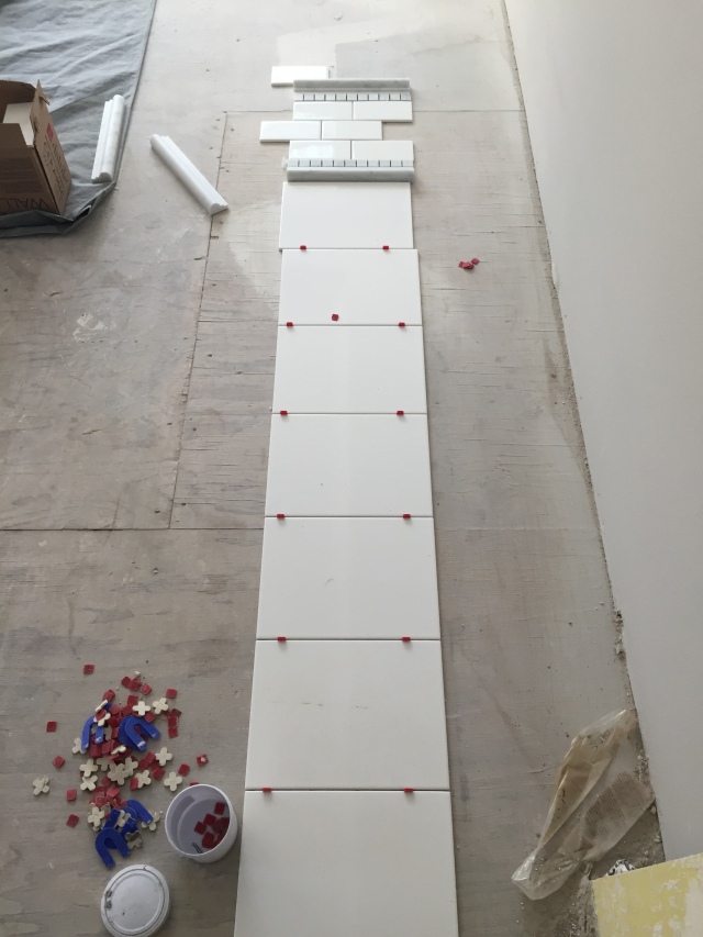 This is the layout of the tile in the master shower. The lower & larger white tiles will be in a brick pattern, then there will be a detail band and then white subway tiles above it.
